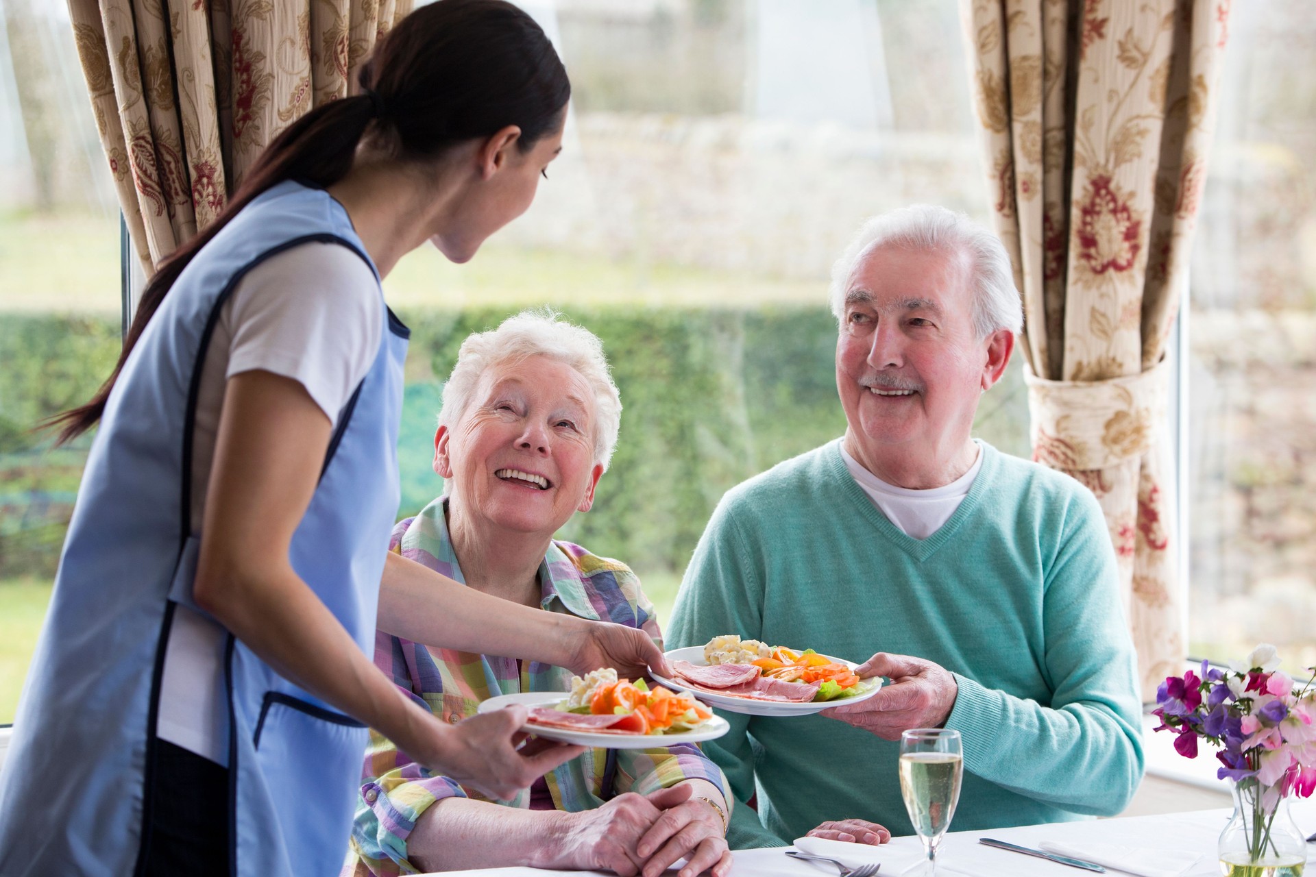 Senior Couple Getting Served Food
